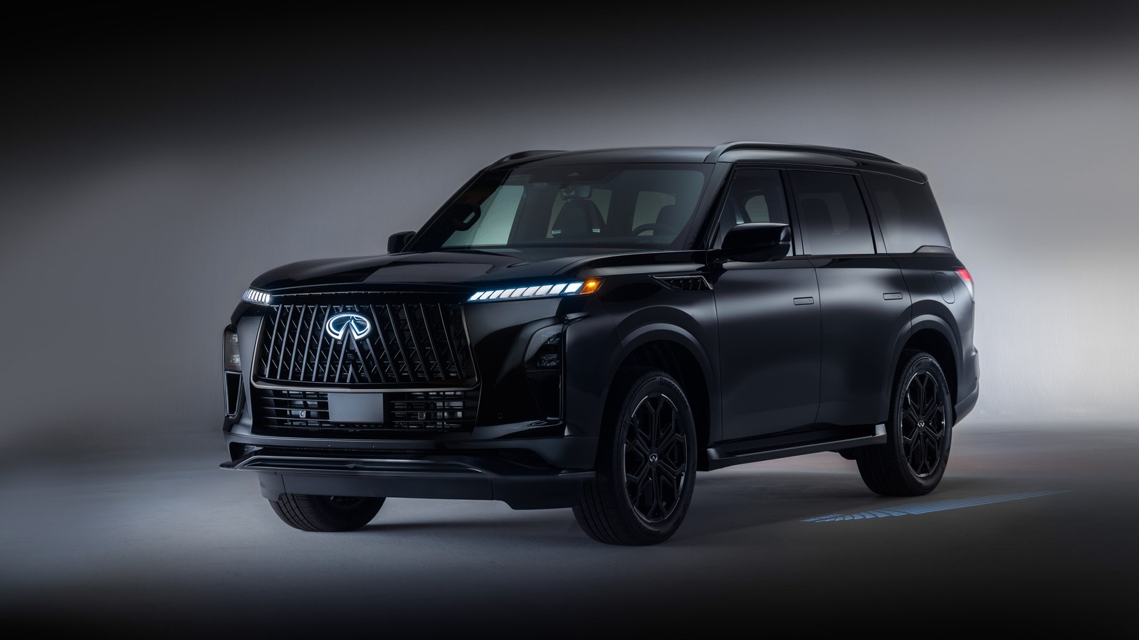 2027 INFINITI QX80 press photograph &mdash; front three-quarter view
