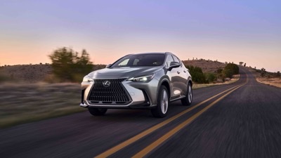2026 Lexus NX 350 AWD in silver, on the open road at dusk